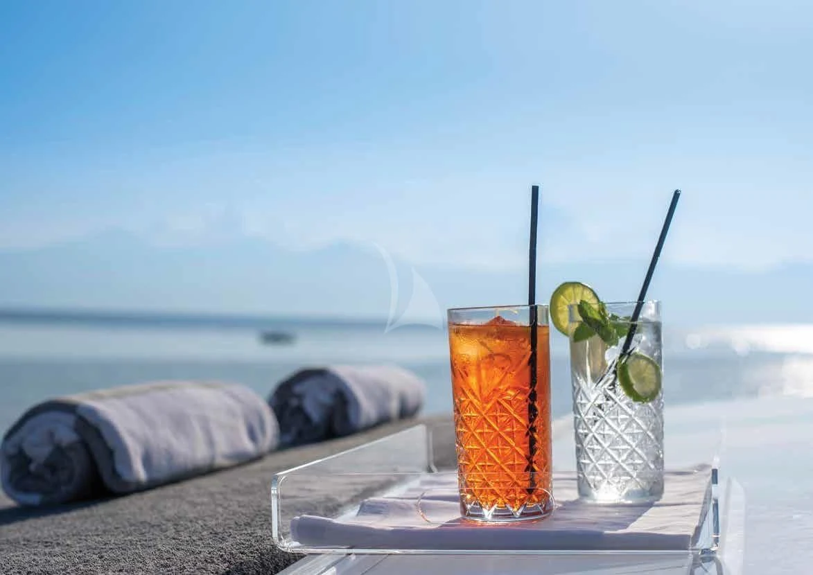 a tray with drinks and a straw aboard IRENE'S Yacht for Sale