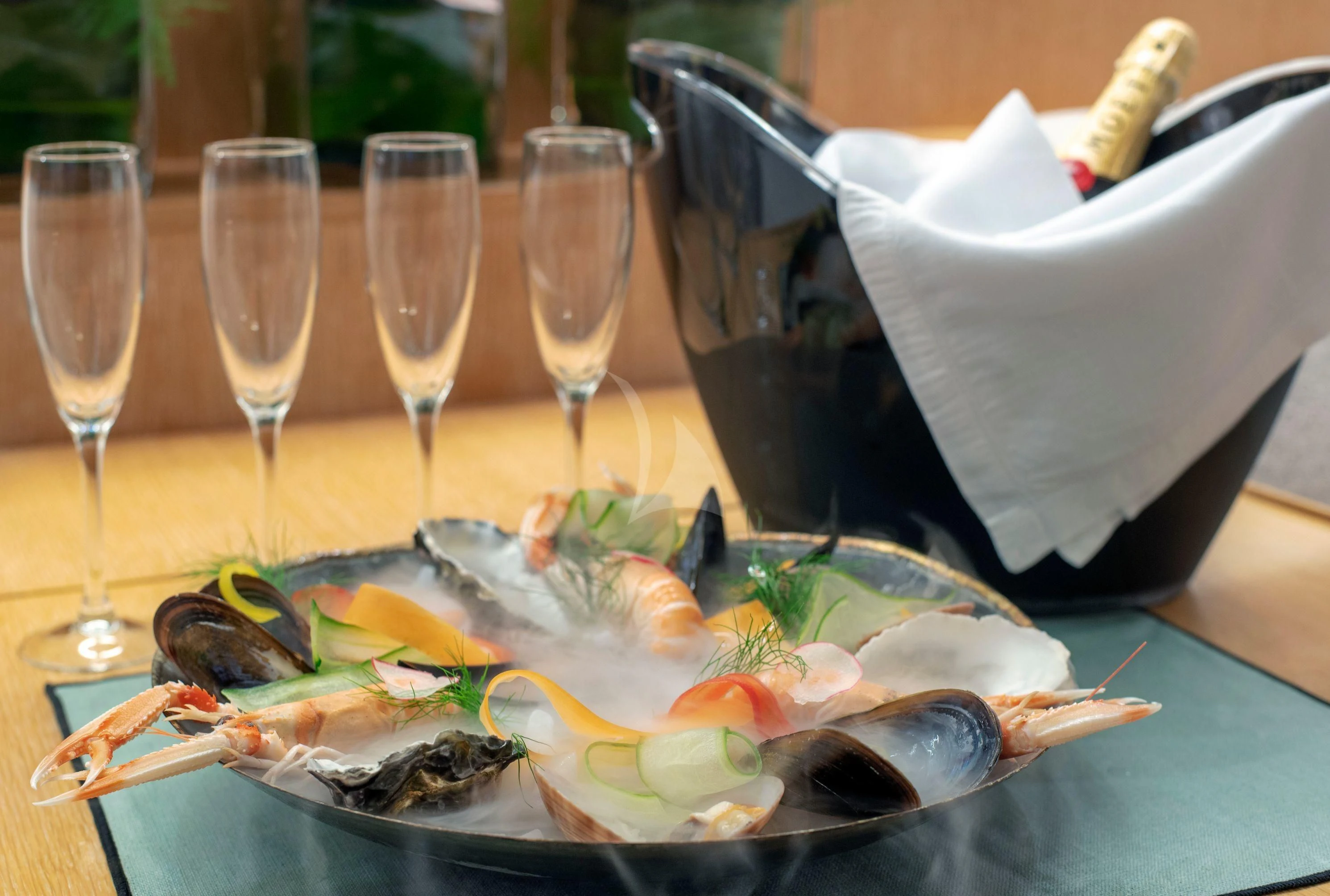 a plate of food and glasses aboard IRENE'S Yacht for Sale