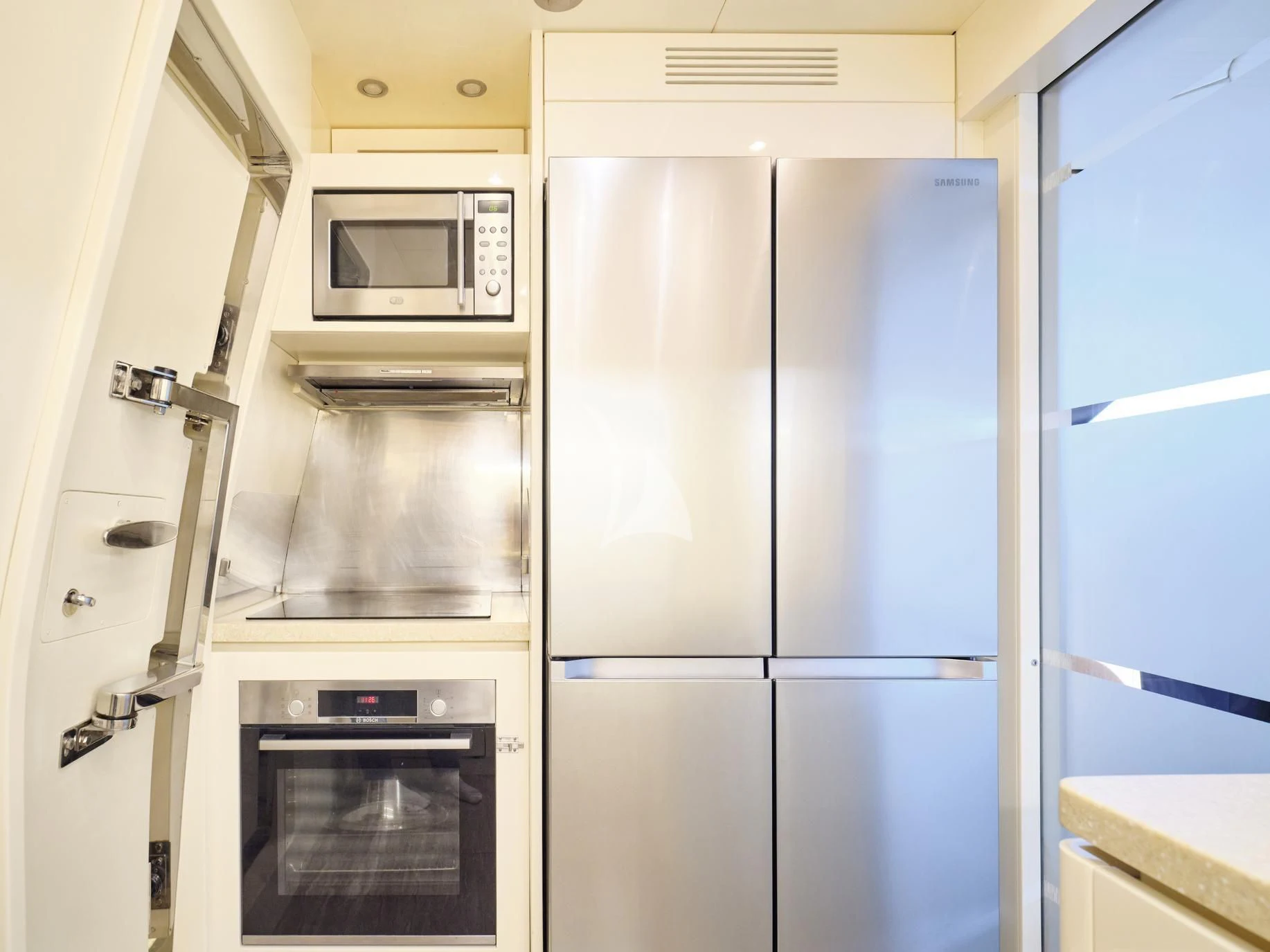 a kitchen with white cabinets aboard IRENE'S Yacht for Sale