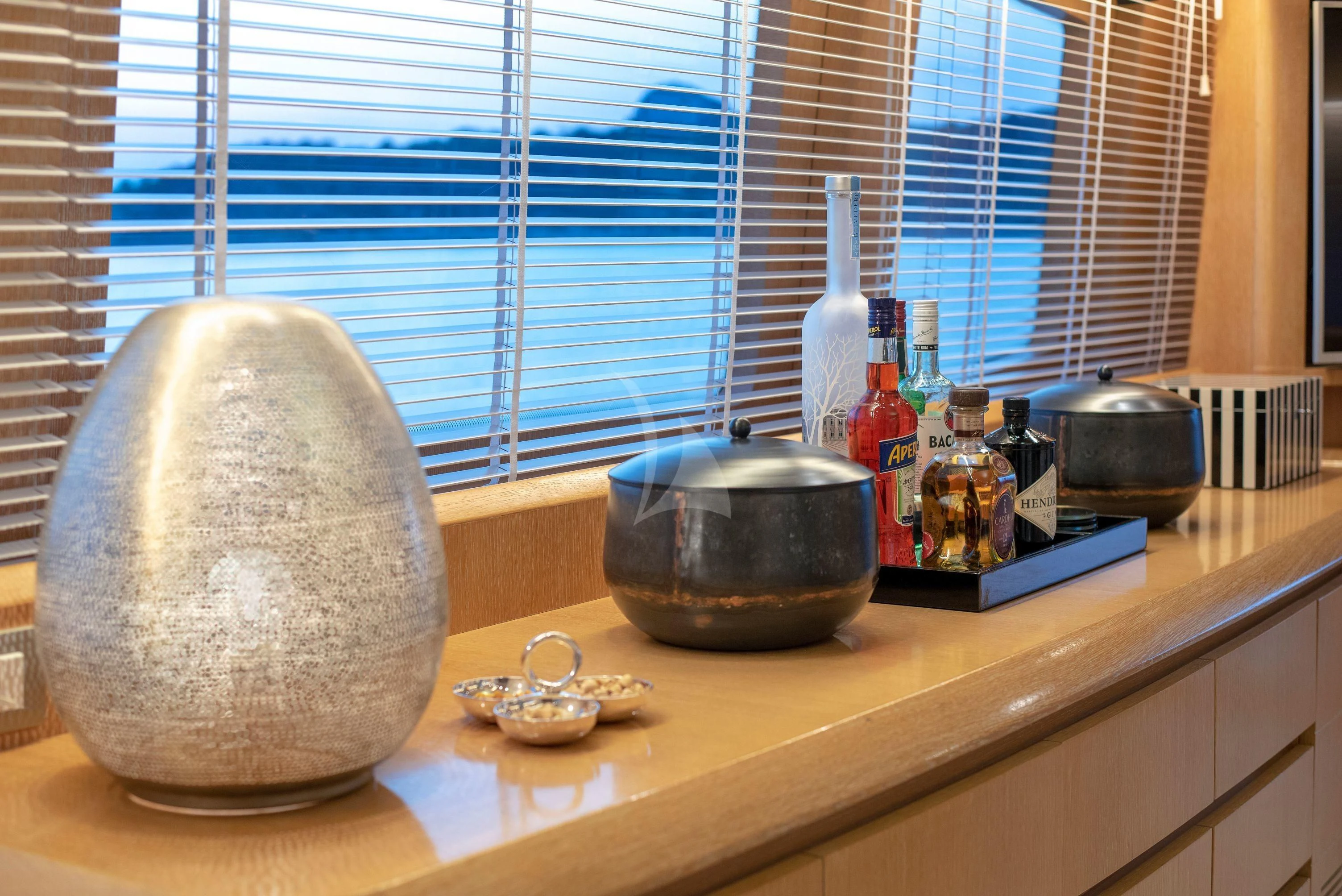 a kitchen counter with a silver pot and a silver bowl on it aboard IRENE'S Yacht for Sale