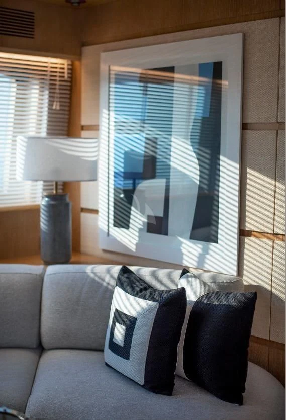 a couch with pillows and a lamp aboard IRENE'S Yacht for Sale