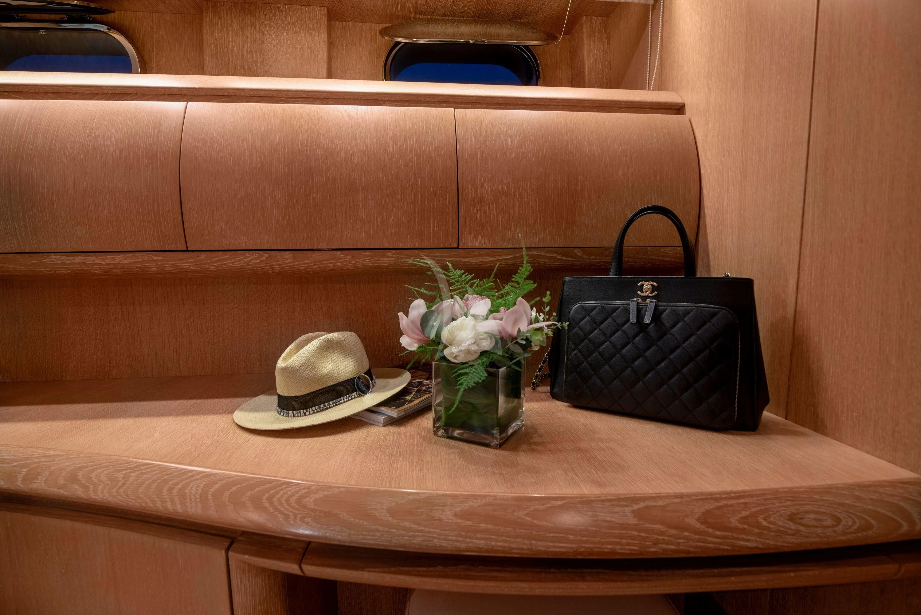 a hat and a purse on a table aboard IRENE'S Yacht for Sale