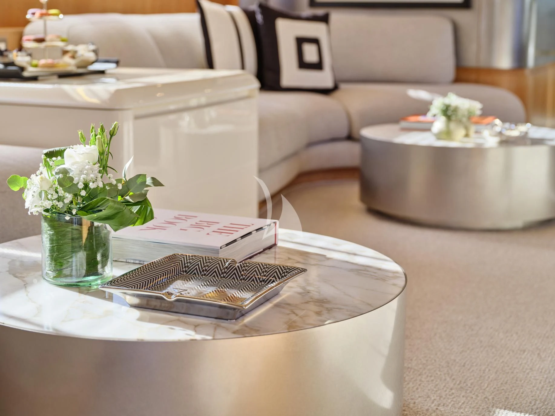 a table with a glass of water and a tray with food on it aboard IRENE'S Yacht for Sale