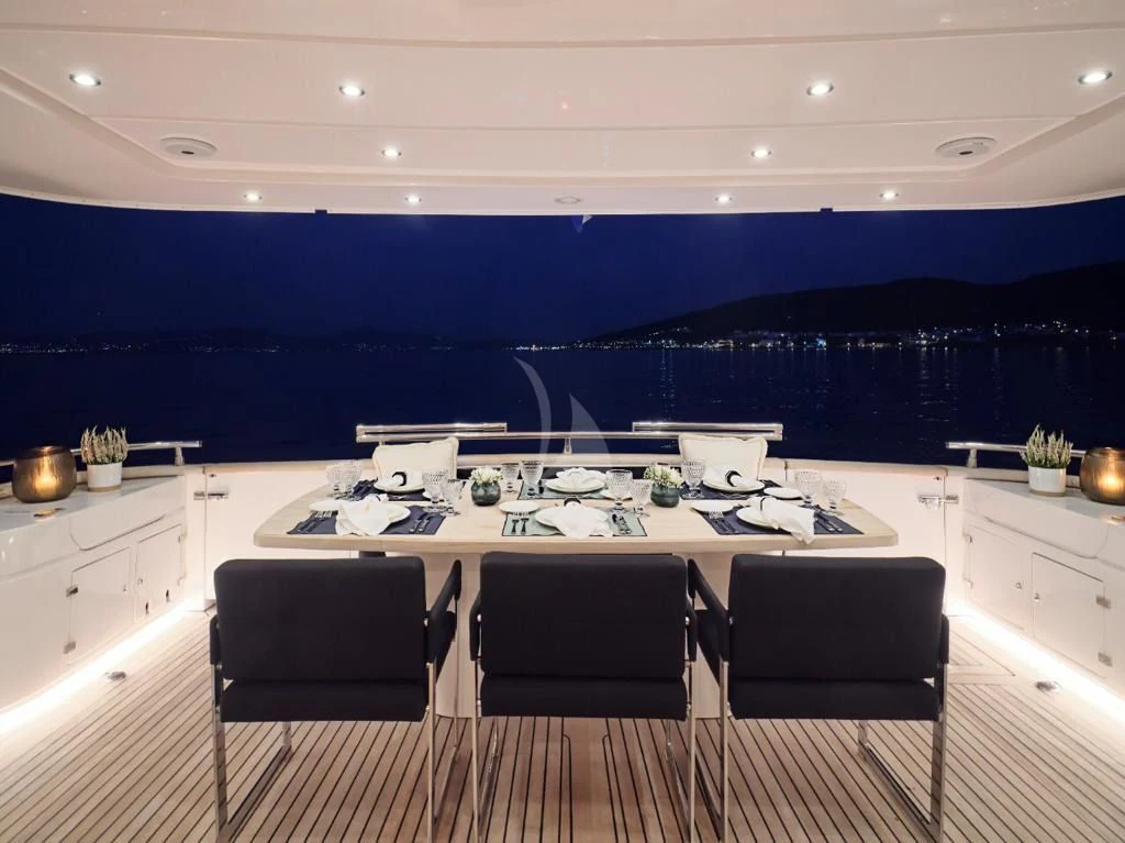 a large kitchen with a table and chairs aboard IRENE'S Yacht for Sale