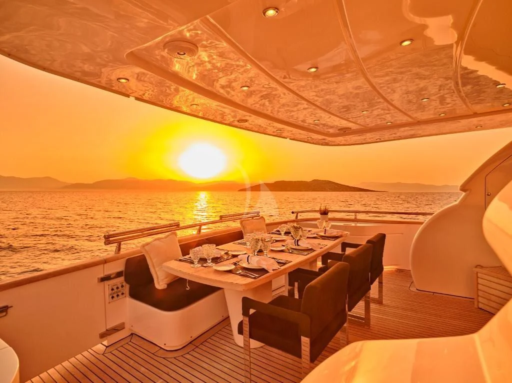 a room with a table and chairs aboard IRENE'S Yacht for Sale