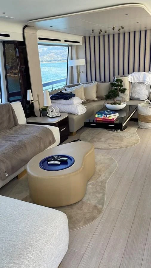 a living room with a couch and a coffee table aboard SUN LIFE Yacht for Sale