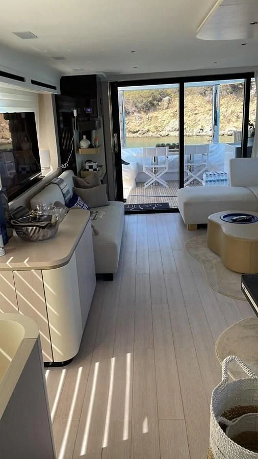 a living room with a large window aboard SUN LIFE Yacht for Sale