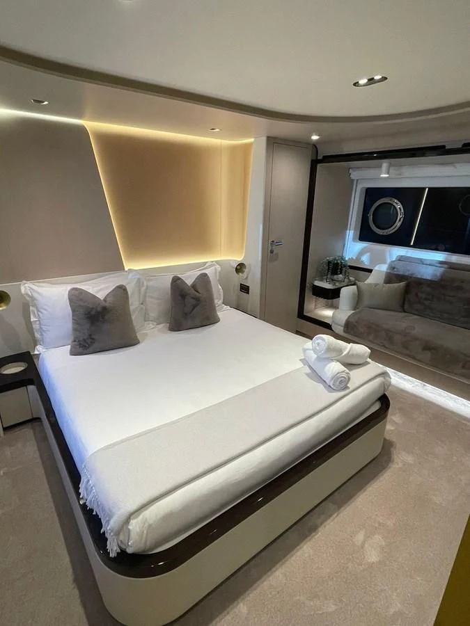 a bed with a white sheet aboard SUN LIFE Yacht for Sale