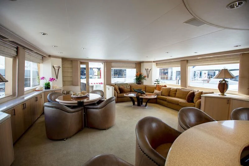 a living room with a kitchen and dining area aboard LADY GRACE Yacht for Sale