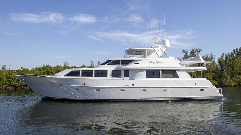 a white yacht on the water aboard LADY GRACE Yacht for Sale