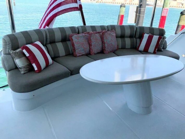 a couch with pillows on it aboard LADY GRACE Yacht for Sale