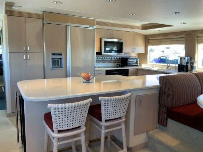 a kitchen with white cabinets aboard LADY GRACE Yacht for Sale