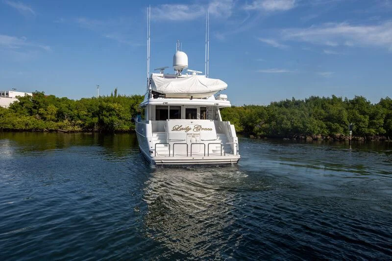 a white boat on water aboard LADY GRACE Yacht for Sale