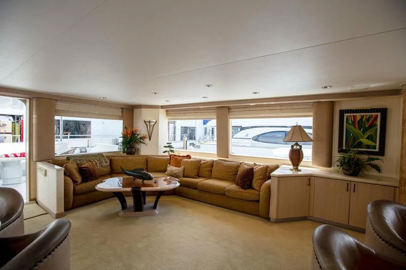 a living room with a couch and a table aboard LADY GRACE Yacht for Sale