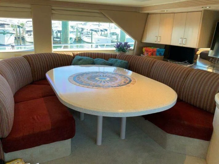 a living room with a couch and a coffee table aboard LADY GRACE Yacht for Sale
