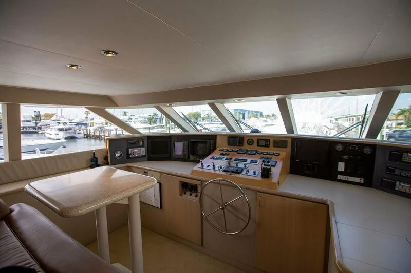 a room with a table and chairs aboard LADY GRACE Yacht for Sale