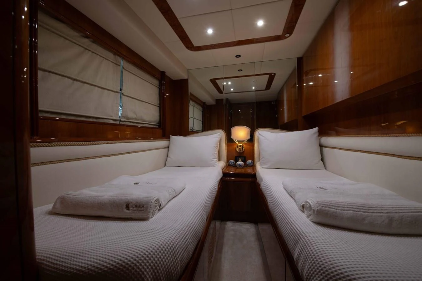 a room with two beds aboard STOLI Yacht for Sale