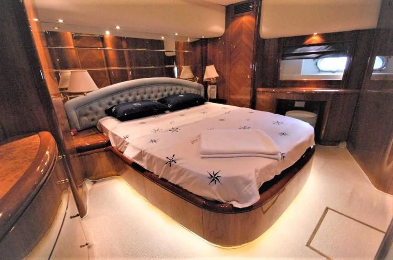 a bed in a room aboard STOLI Yacht for Sale