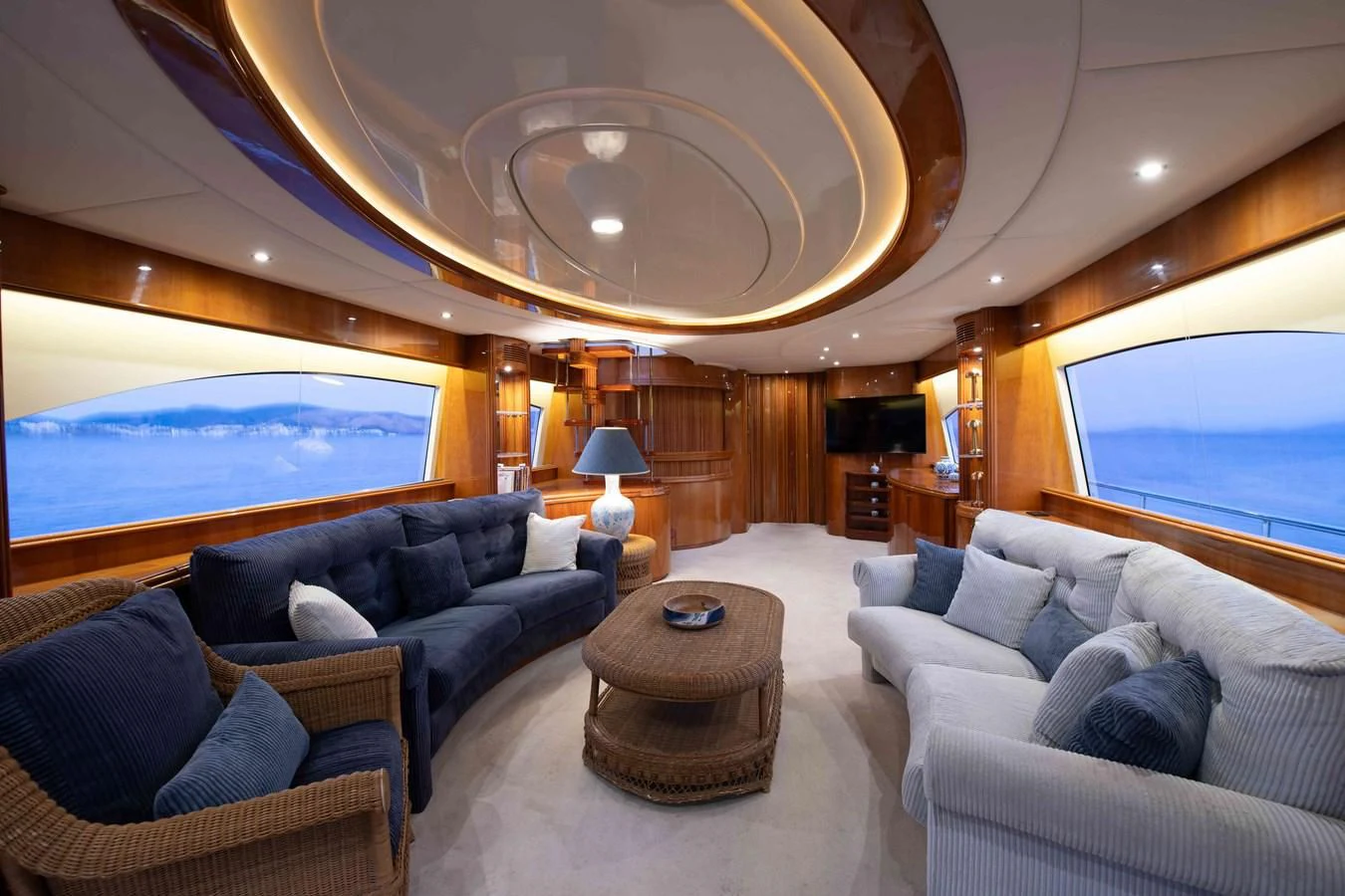a living room with a large skylight aboard STOLI Yacht for Sale