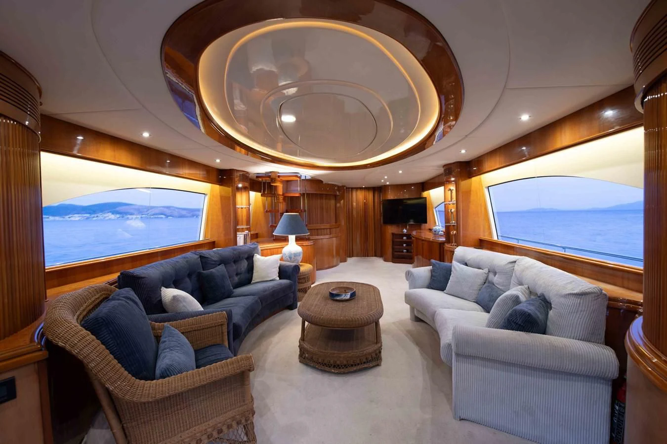 a living room with a large skylight aboard STOLI Yacht for Sale