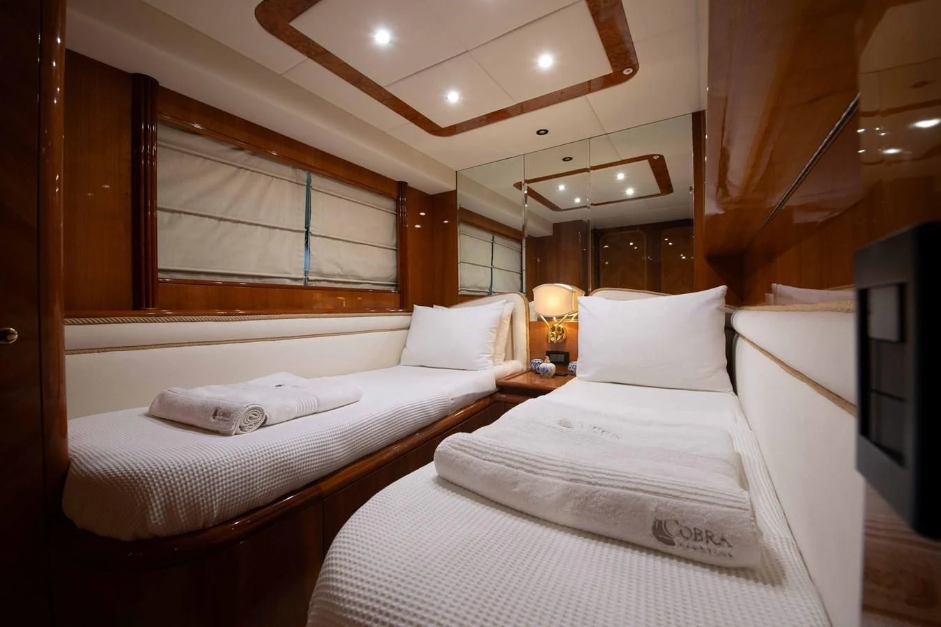 a room with two beds aboard STOLI Yacht for Sale