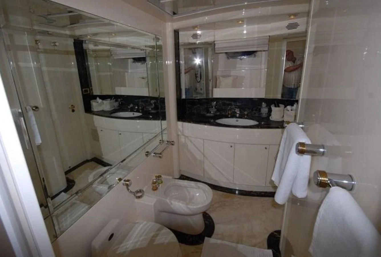 a bathroom with a bathtub and sink aboard STOLI Yacht for Sale