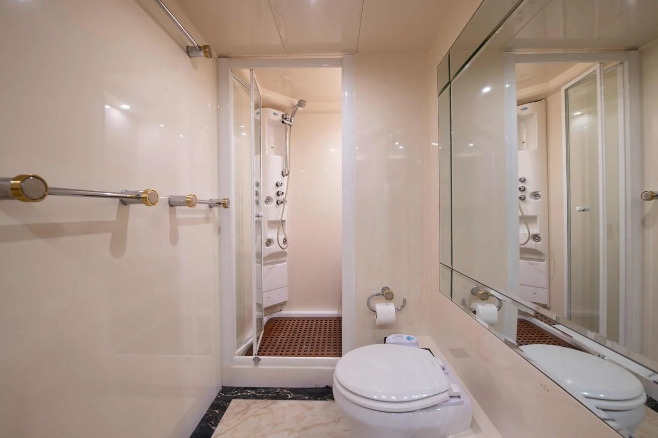 a bathroom with a glass shower aboard STOLI Yacht for Sale