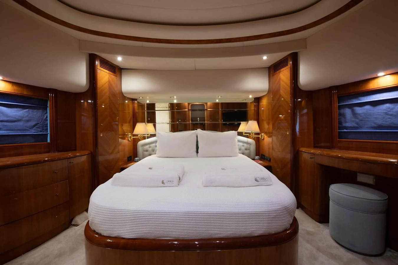 a bed with white sheets aboard STOLI Yacht for Sale