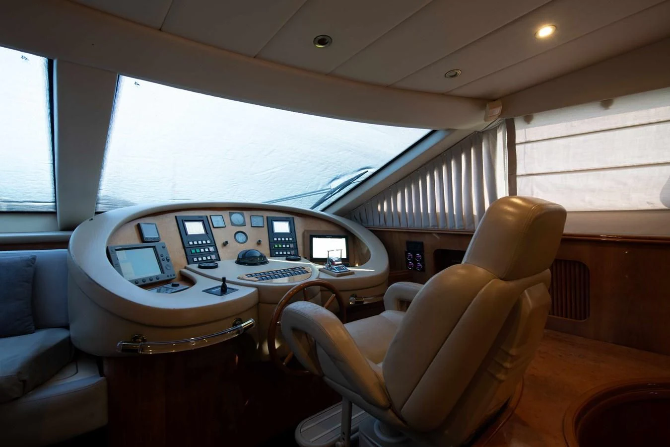 a white table with a laptop on it aboard STOLI Yacht for Sale