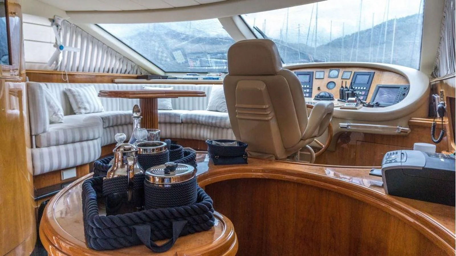 a tent with a table and chairs aboard STOLI Yacht for Sale