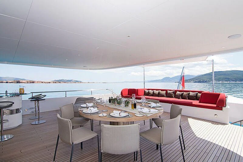 a table with chairs on it aboard MY EDEN Yacht for Sale