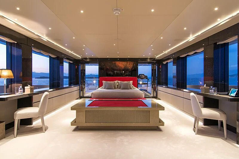 a room with a bed and a desk aboard MY EDEN Yacht for Sale