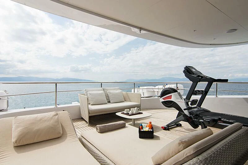 a room with a couch and a pool aboard MY EDEN Yacht for Sale