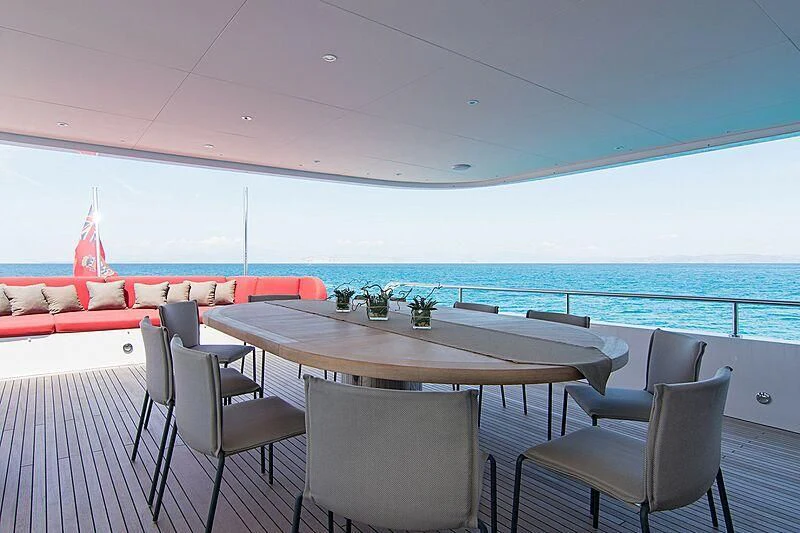 a table with chairs around it aboard MY EDEN Yacht for Sale