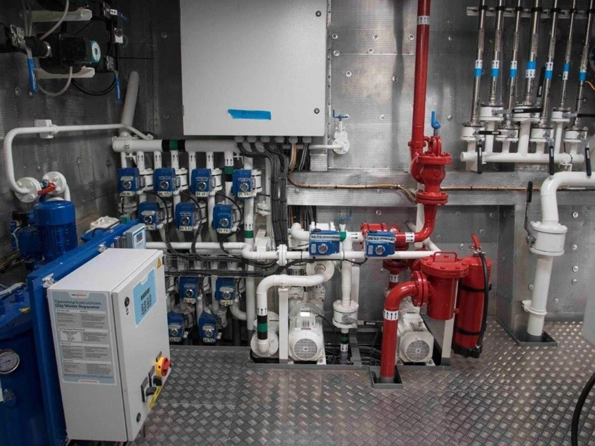 a room with machinery and pipes aboard OCEAN KING 130 Yacht for Sale