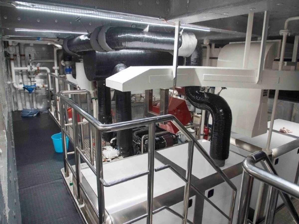 a machine in a room aboard OCEAN KING 130 Yacht for Sale