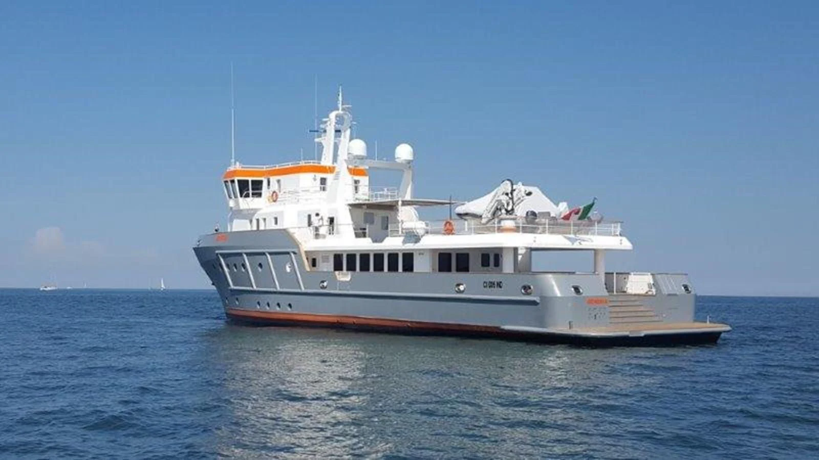 a large boat in the water aboard OCEAN KING 130 Yacht for Sale