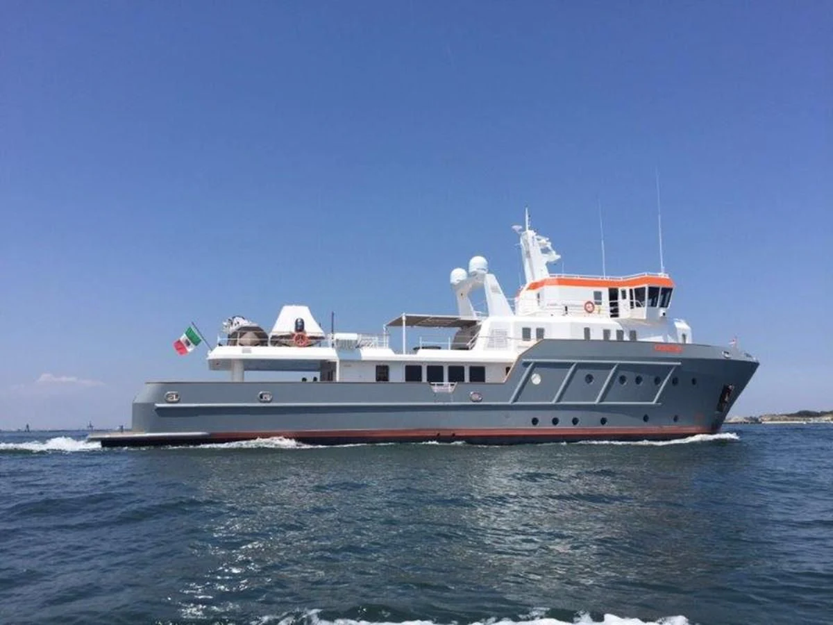 a large boat in the water aboard OCEAN KING 130 Yacht for Sale