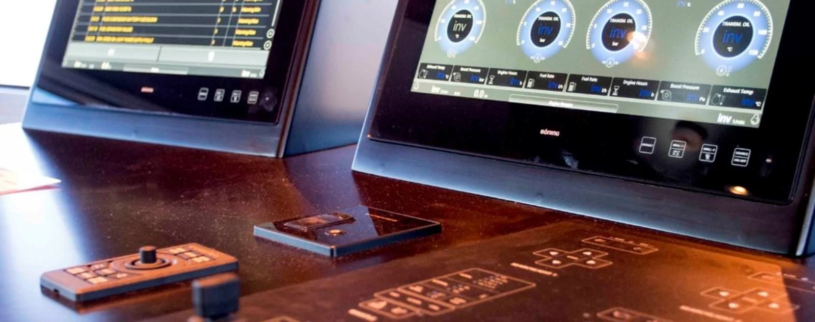 a close-up of a game console and a remote aboard OCEAN KING 130 Yacht for Sale