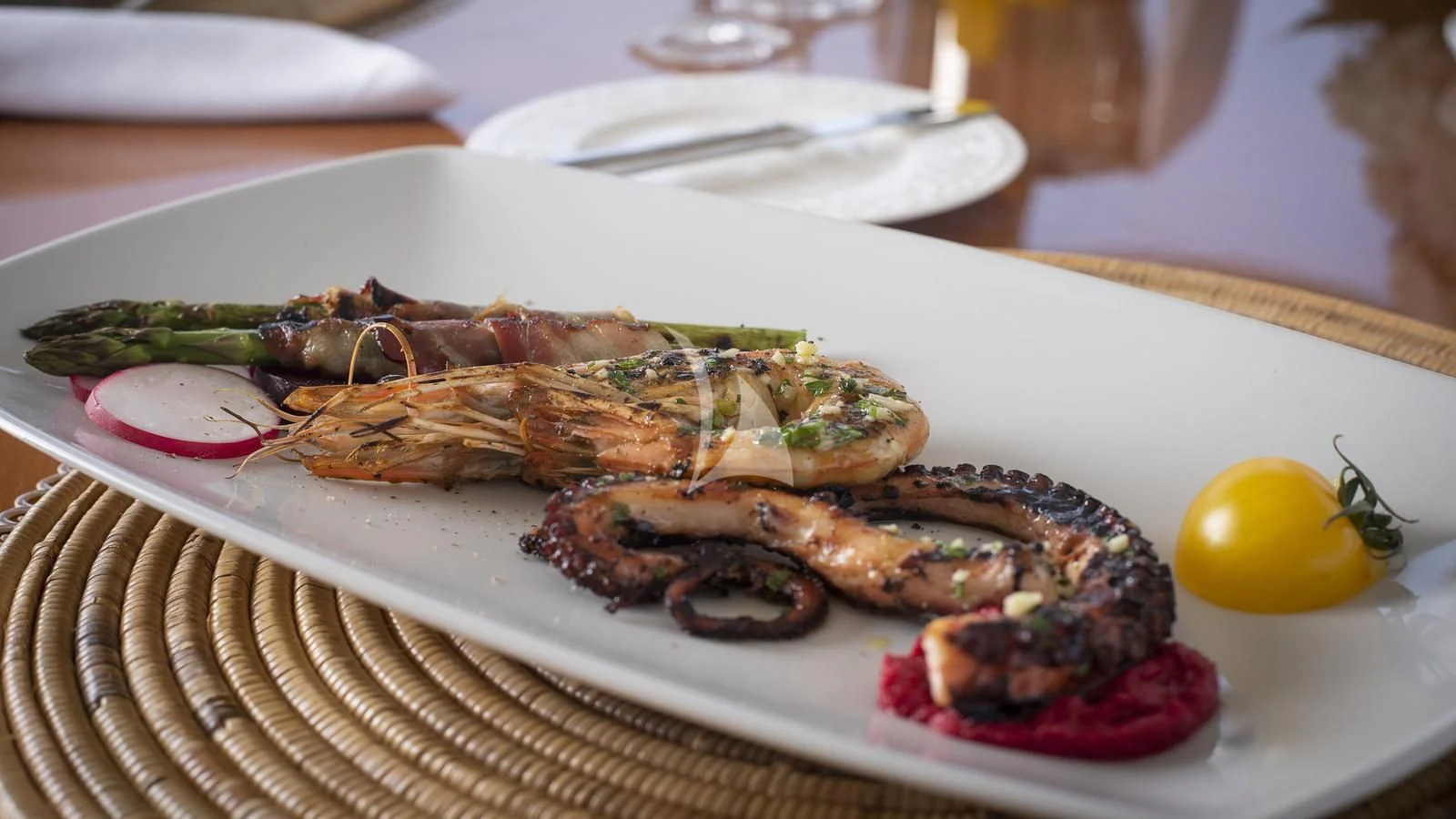 a plate of food aboard IMAGINE Yacht for Charter