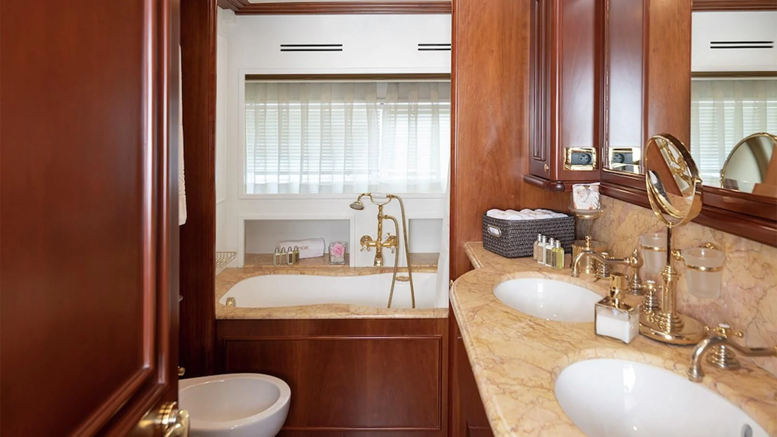 a bathroom with a sink and a bathtub aboard IMAGINE Yacht for Charter
