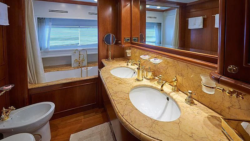 a bathroom with a sink and a bathtub aboard IMAGINE Yacht for Charter