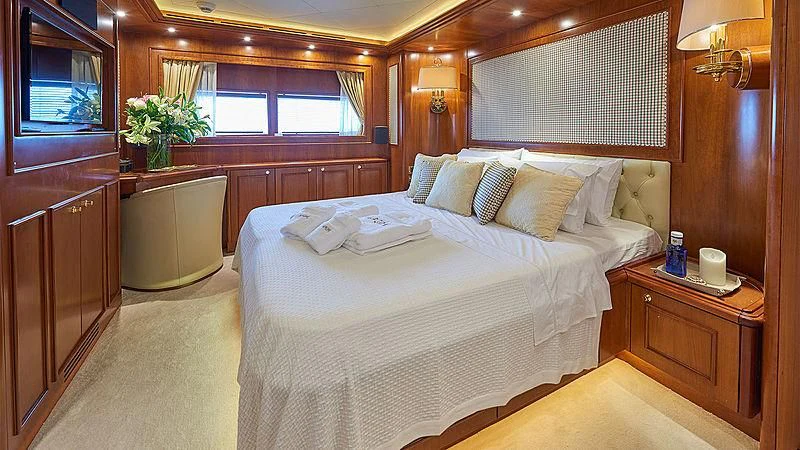 a bed in a room aboard IMAGINE Yacht for Charter