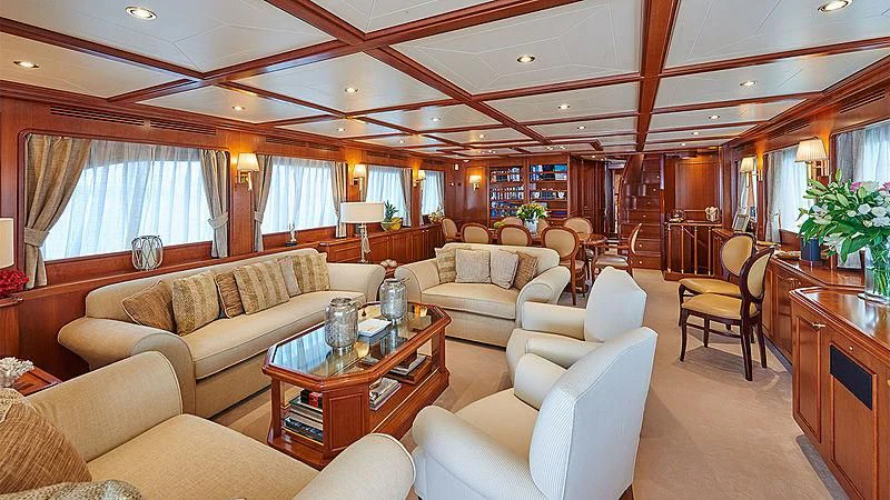 a living room with a table and chairs aboard IMAGINE Yacht for Charter