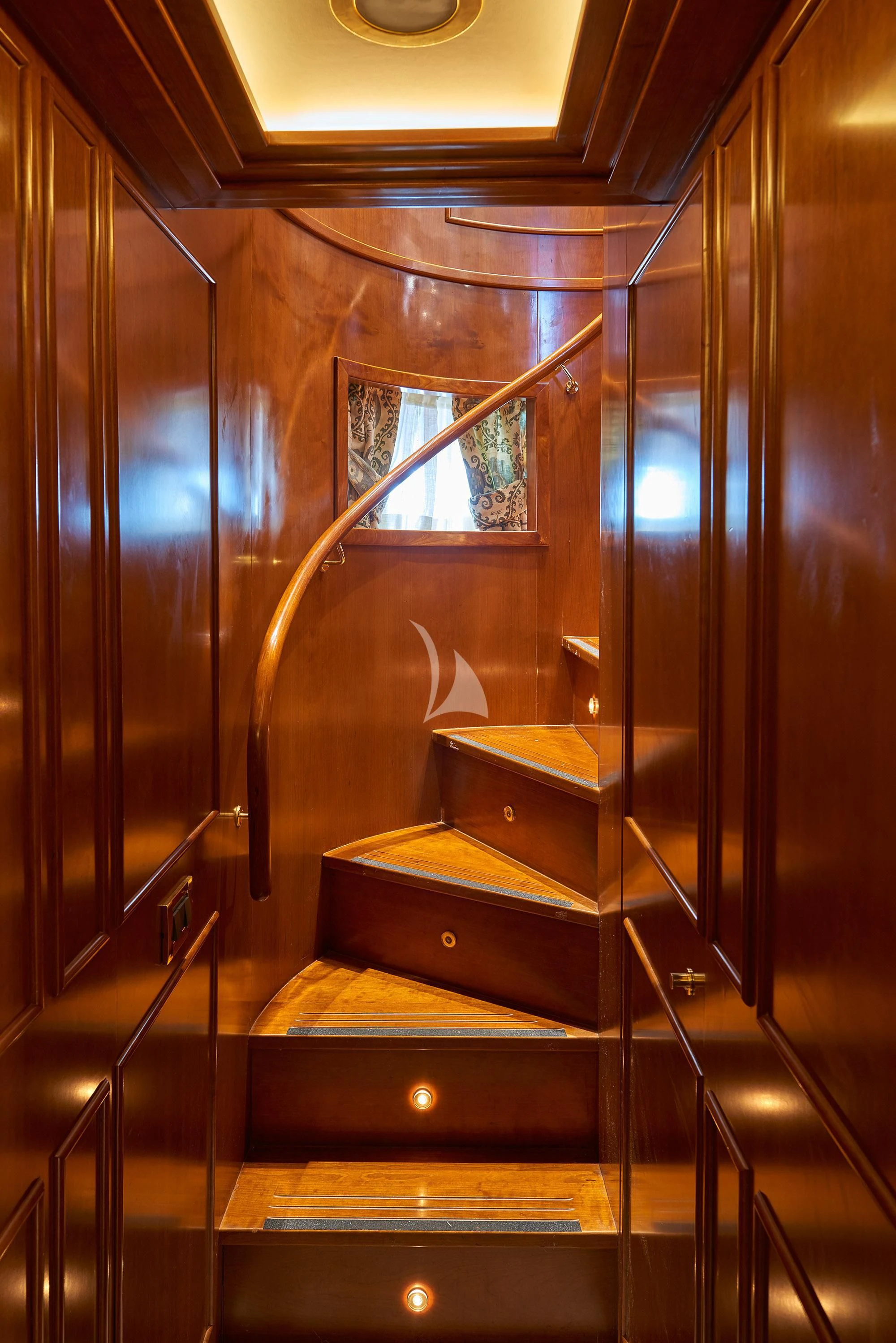 a wooden staircase with a glass door aboard IMAGINE Yacht for Charter