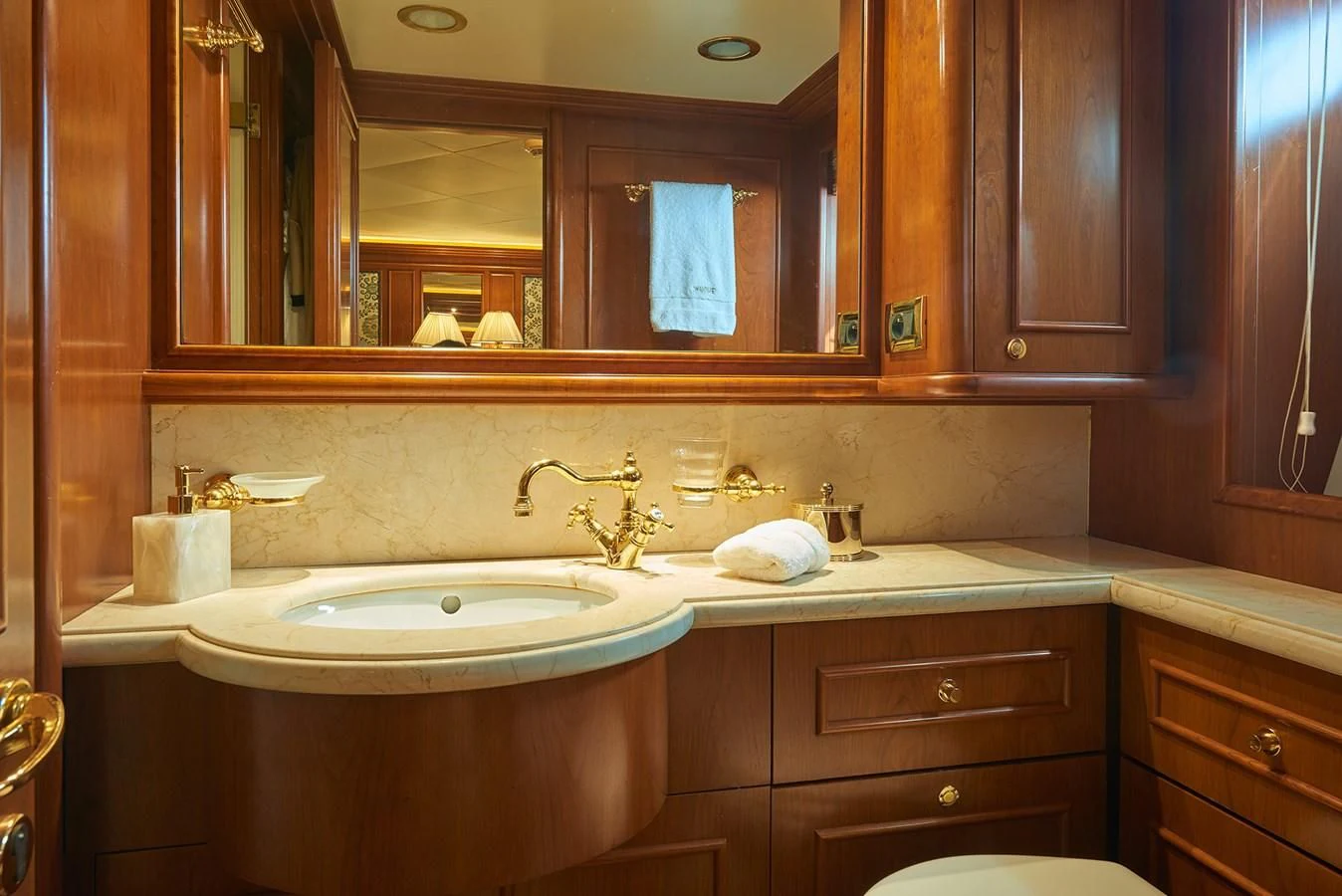 a bathroom with a large mirror aboard IMAGINE Yacht for Charter