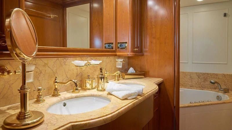 a bathroom with a sink and a mirror aboard IMAGINE Yacht for Charter