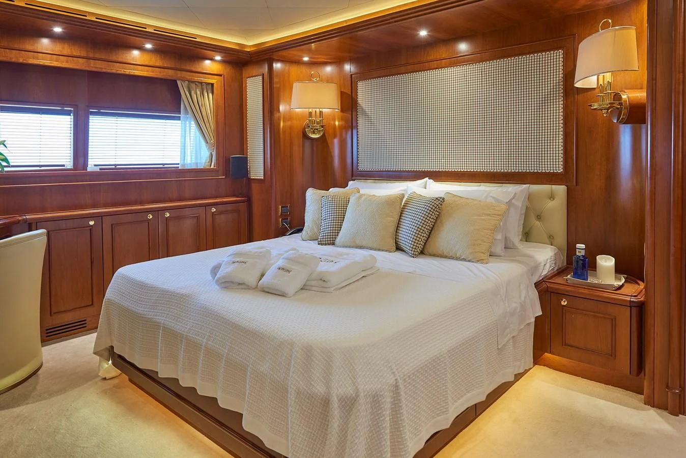 a bed in a room aboard IMAGINE Yacht for Charter