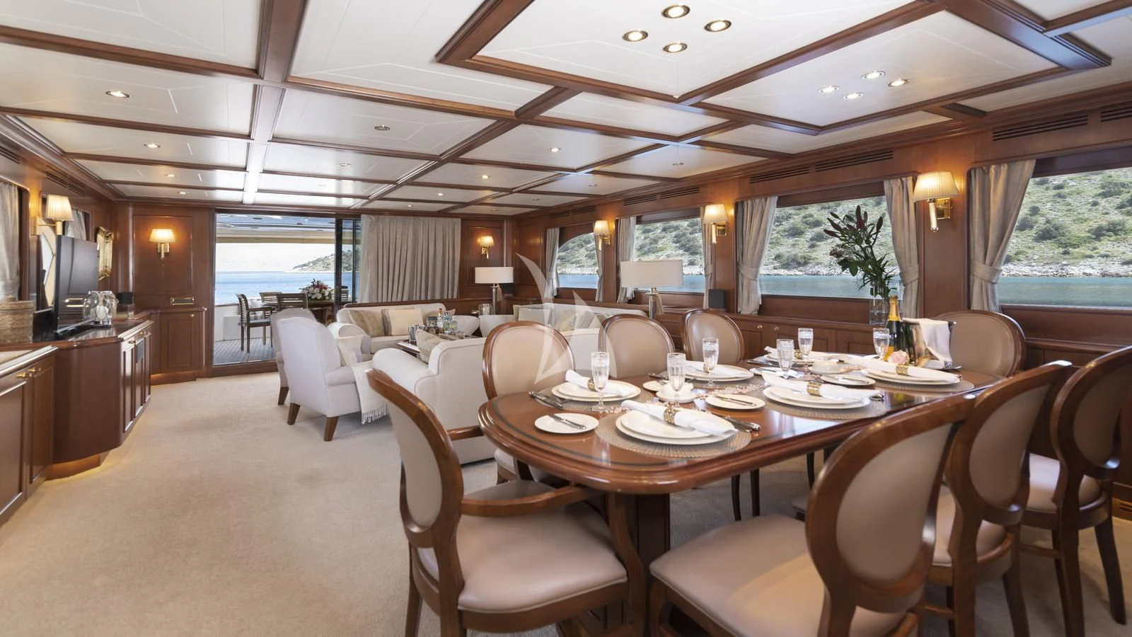 a dining room with a table and chairs aboard IMAGINE Yacht for Charter