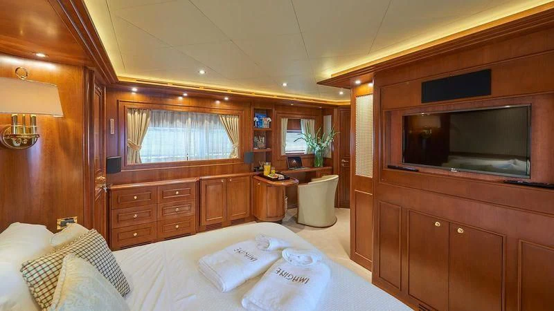a bed in a room aboard IMAGINE Yacht for Charter